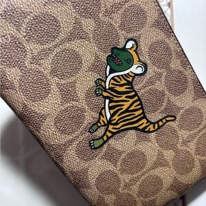 COACH Tiger Rexy wristlet